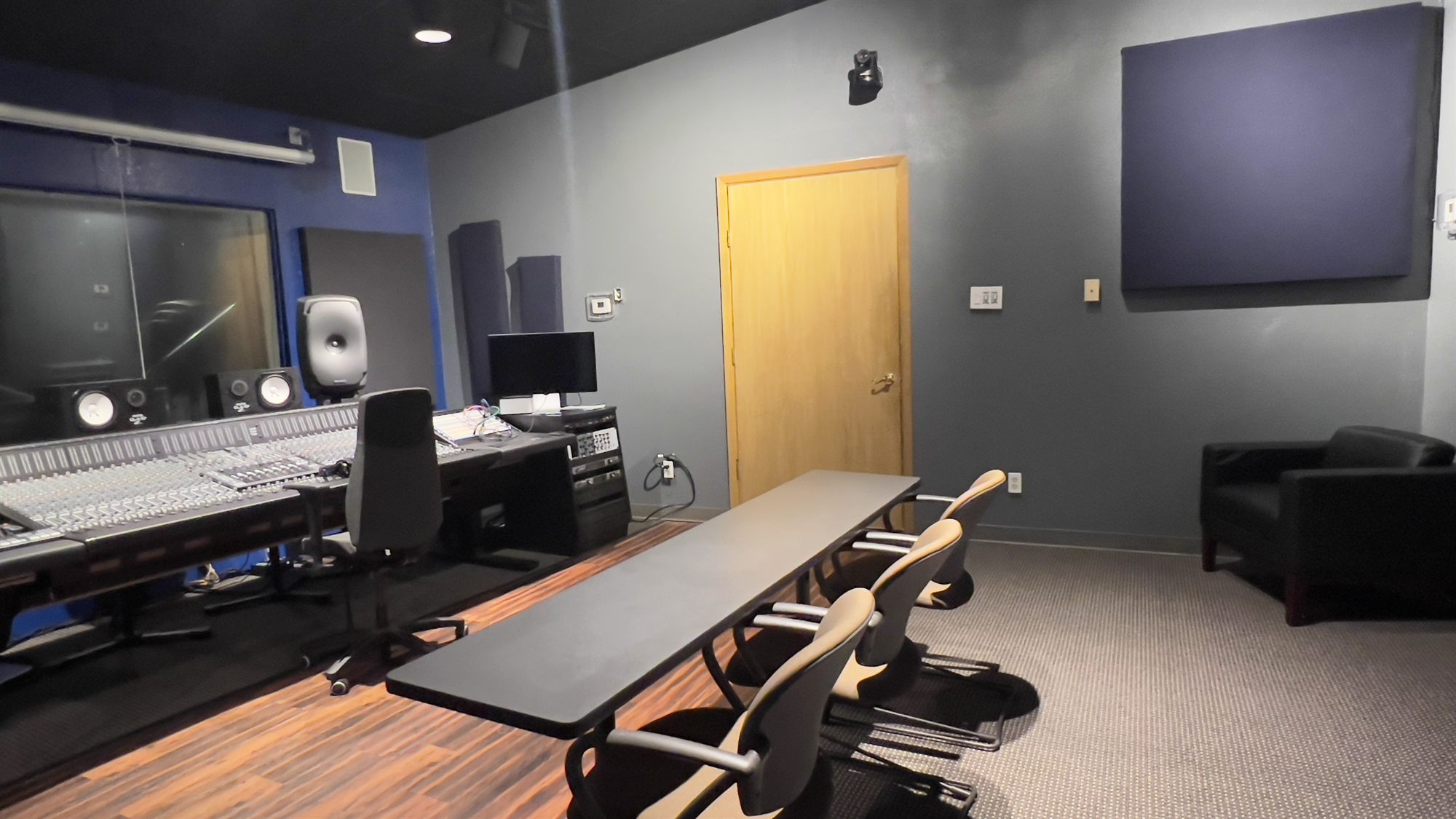 Rear of the control room with acoustic panels and lounge chair