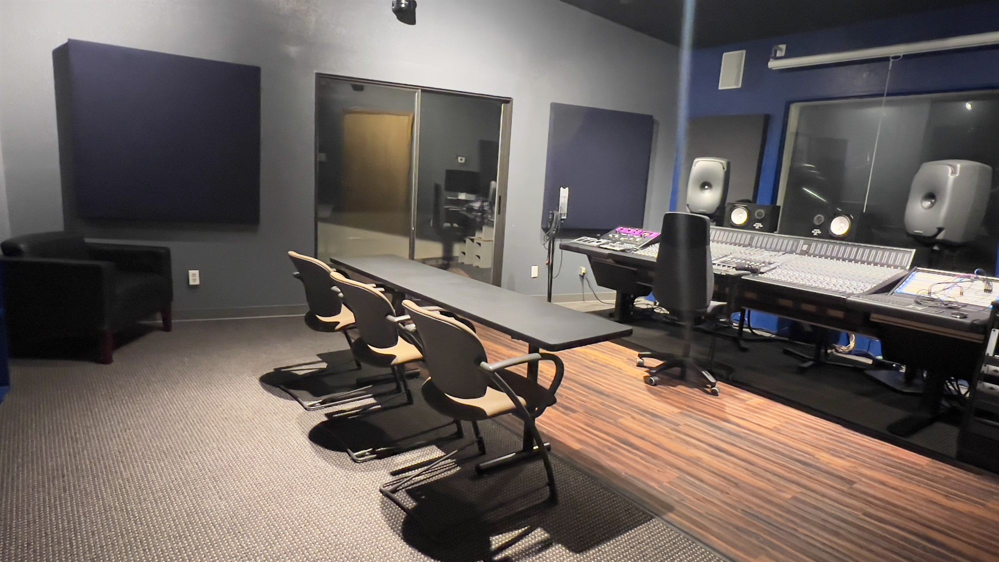 Client table and seating beside the console